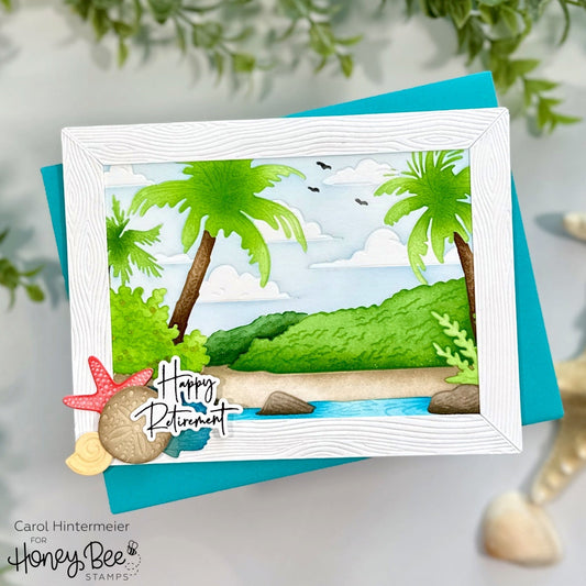 Handmade beach scene retirement card with palm trees, starfish, and shells in a white frame.