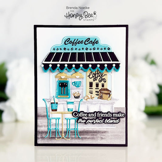 Handmade card featuring a 3D coffee cafe scene with the quote 'Coffee and friends make the perfect blend'.