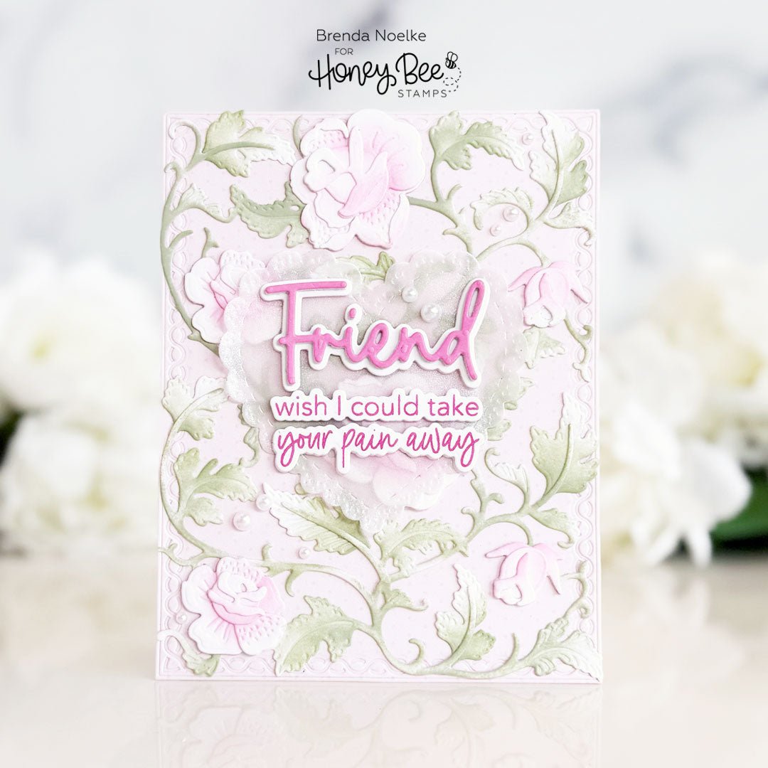 Handmade sympathy card with pink floral die-cuts and 'Friend wish I could take your pain away' text.