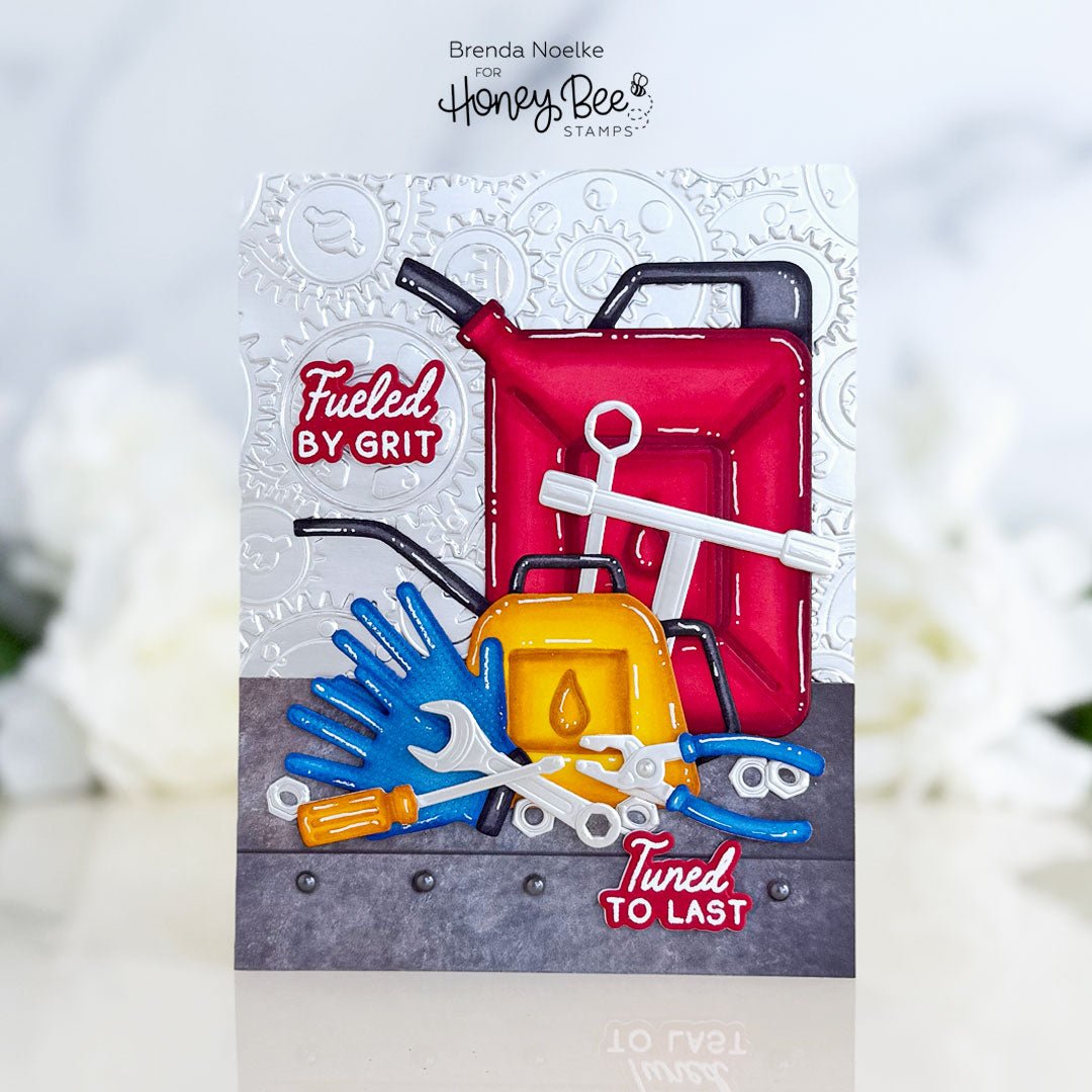Handmade card with 3D embossed tools, red gas can, and 'Fueled by Grit' sentiment.