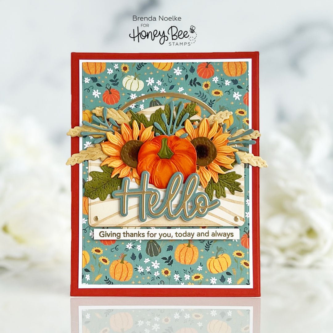 Handmade autumn greeting card with 3D pumpkins, sunflowers, and 'Hello' sentiment.