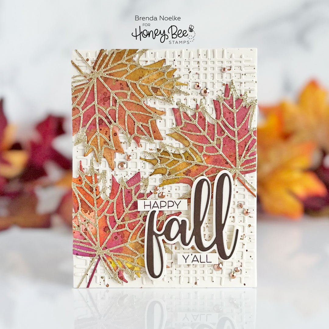 Handmade fall greeting card featuring colorful glittery maple leaves and 'Happy Fall Y'all' text.