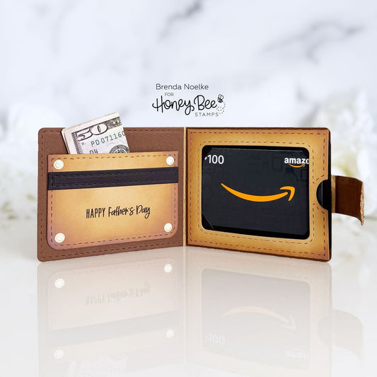Brown leather wallet with 'Happy Father's Day' engraving, containing cash and an Amazon gift card.