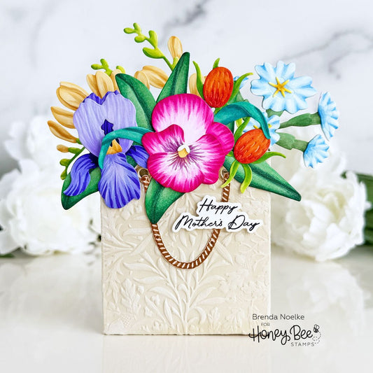 3D pop-up Mother's Day card featuring a textured white bag topped with colorful paper flowers.