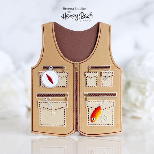 Handmade fishing vest shaped retirement card with miniature compass and lure details.