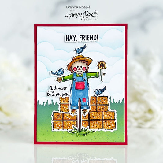 Handmade card with a cute scarecrow illustration and the text 'Hay, Friend! I'd never bale on you.'