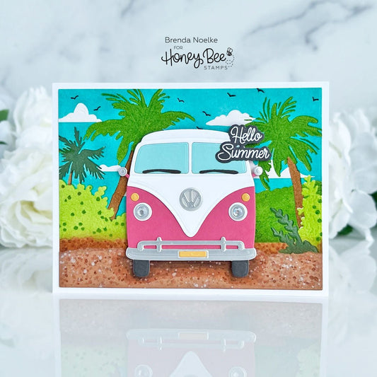 Handmade card featuring a pink and white camper van under palm trees with 'Hello Summer' text.