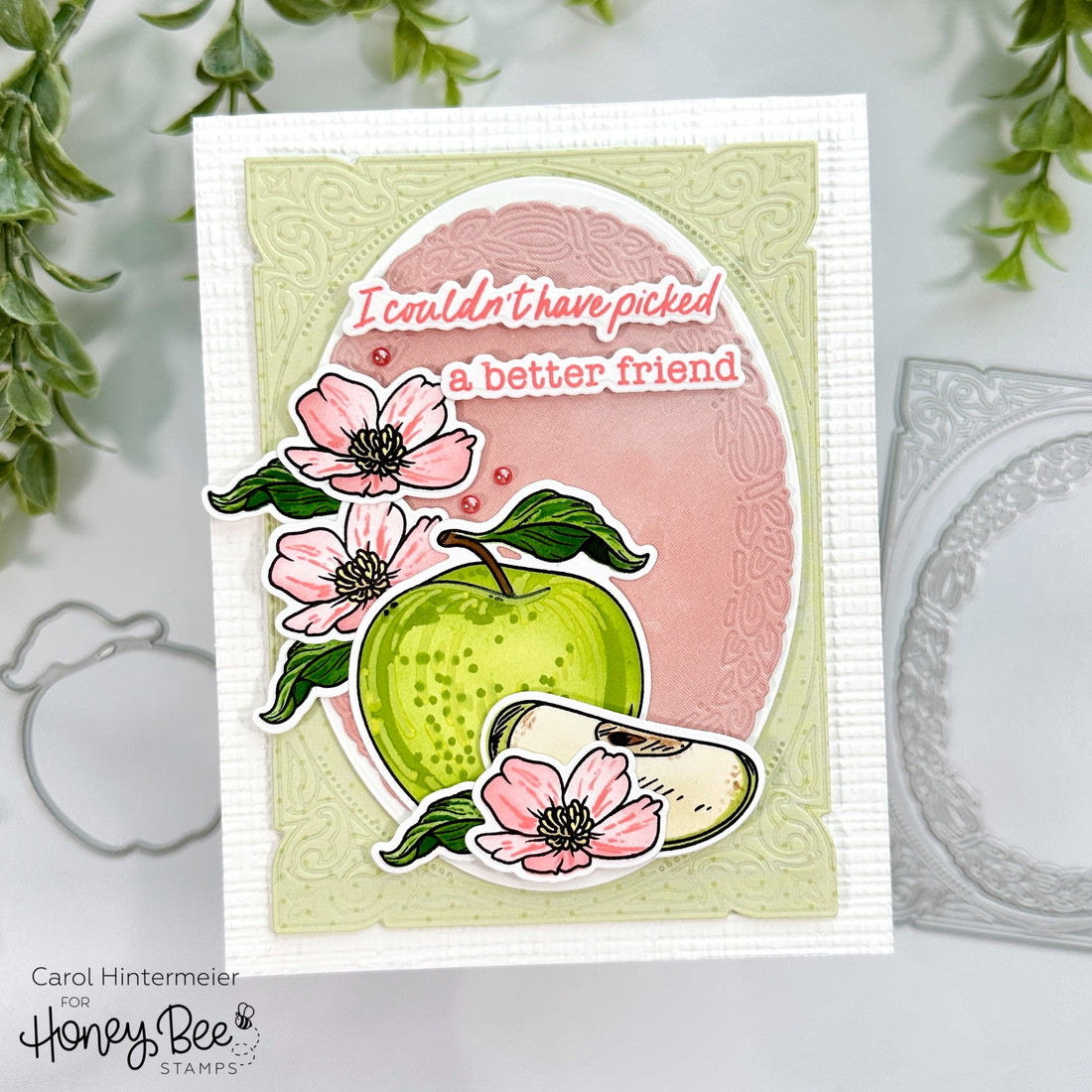 Handmade card with a green apple, pink flowers, and 'I couldn't have picked a better friend' text.