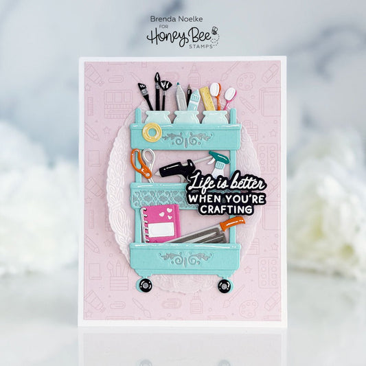 Handmade card featuring a teal craft cart illustration with the phrase Life is better when you're crafting.