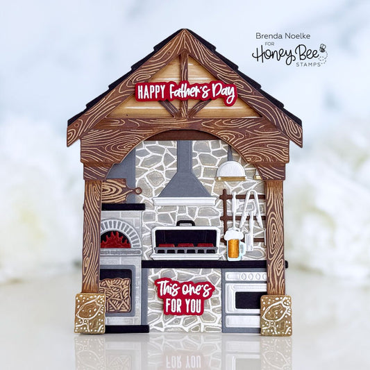 Outdoor kitchen shaped Father's Day card with wood-grain roof and stone detail.