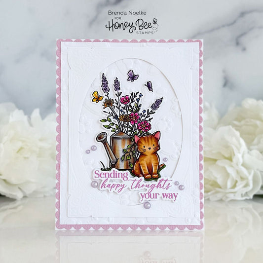 Handmade card featuring an orange cat next to a watering can of flowers and 'Sending happy thoughts your way' text.