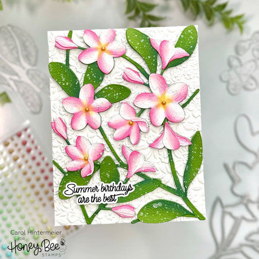 Handmade card with 3D pink plumeria flowers and green leaves reading Summer birthdays are the best