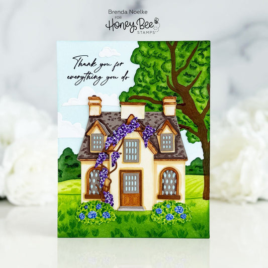 Handmade thank you card featuring a cozy cottage with purple wisteria and a large green tree.