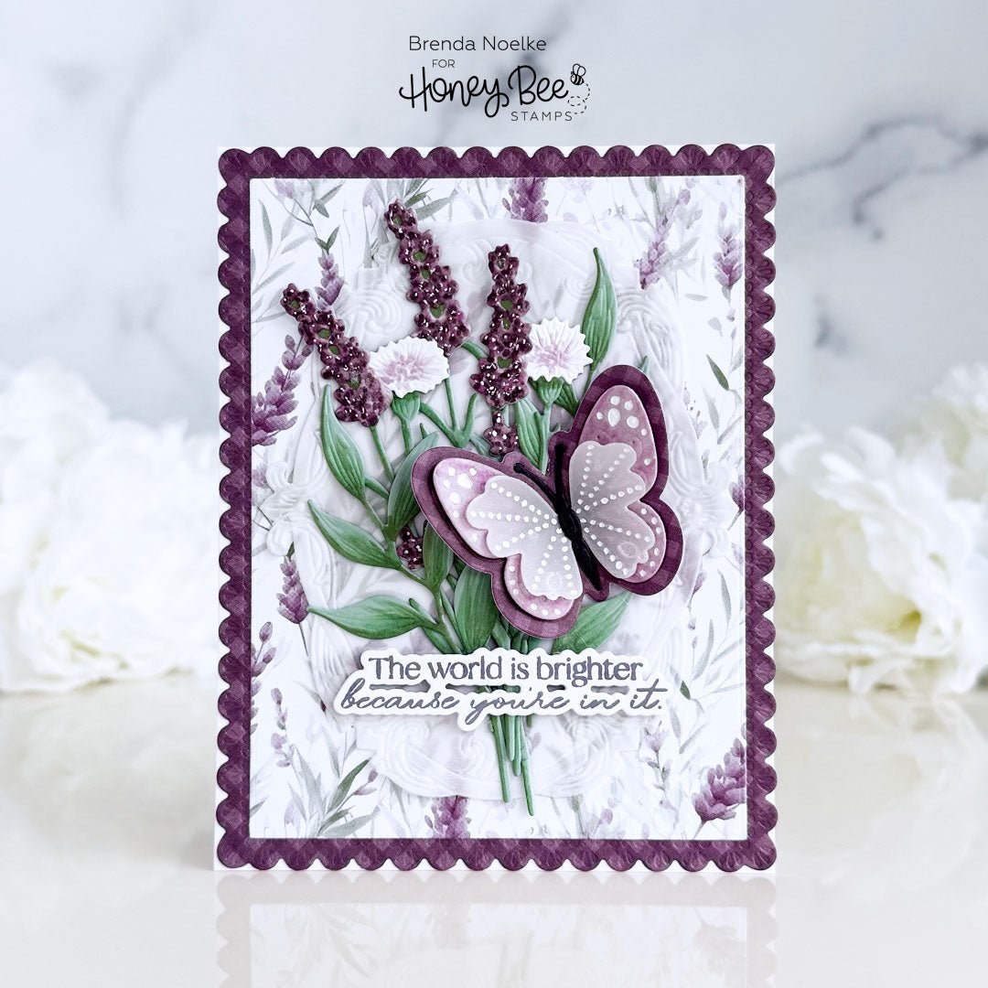 Handmade card with purple butterfly, lavender florals, and sentiment text.