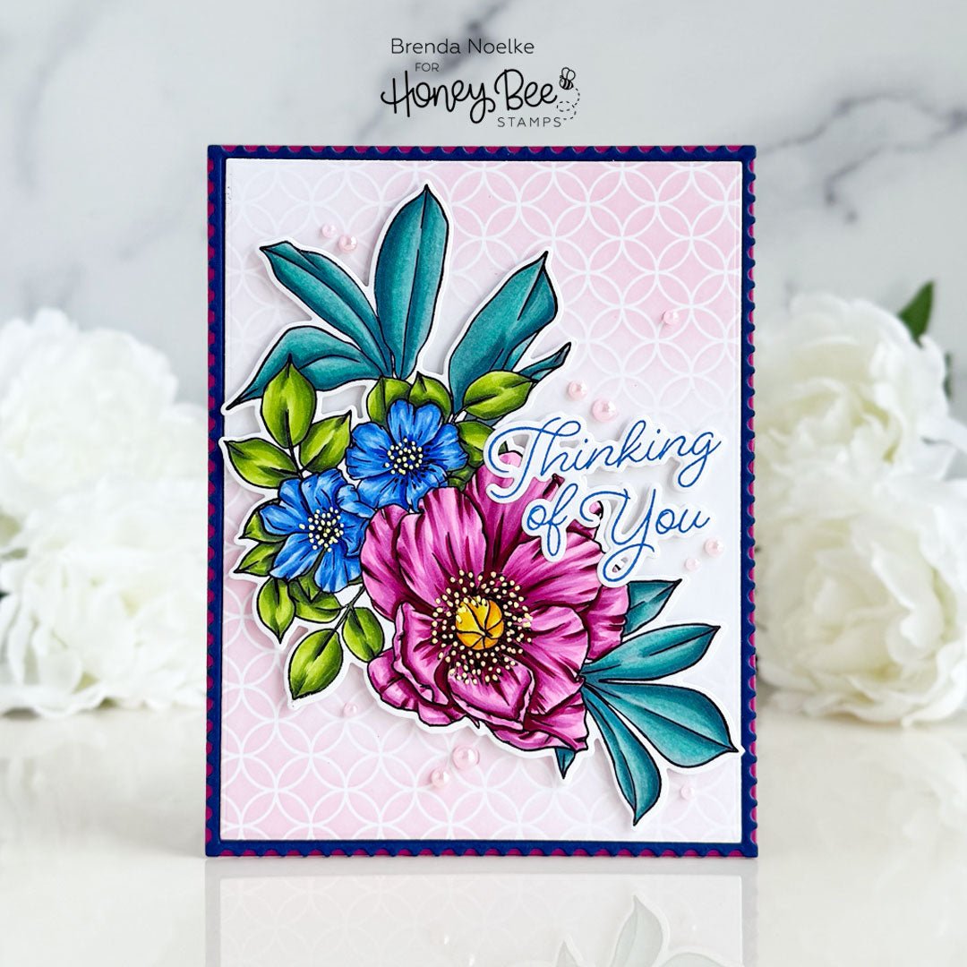 Handmade 'Thinking of You' card featuring colorful stamped peonies and blue flowers.
