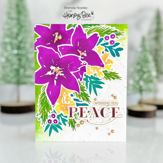 Handmade card with purple watercolor poinsettias, greenery, and 'Wishing You Peace' sentiment.