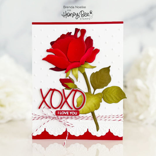 Handmade Valentine's card with a 3D red rose, XOXO lettering, and I Love You sentiment.
