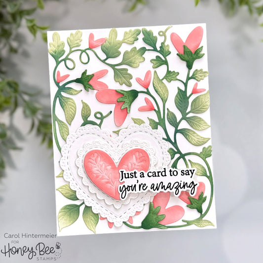 Handmade 'You're Amazing' card featuring green vine die-cuts and pink hearts.