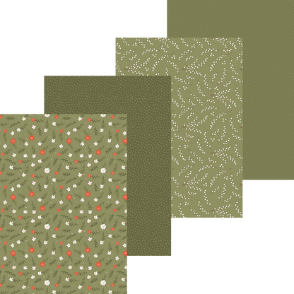 Set of green patterned paper sheets on a white background