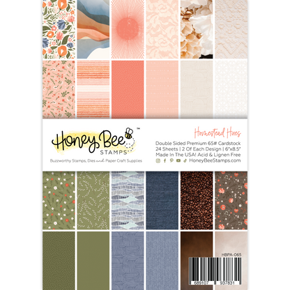 Honey Bee Stamps cardstock pack with various patterns and colors on a white background