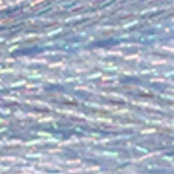 Close-up of iridescent glitter on a light blue background