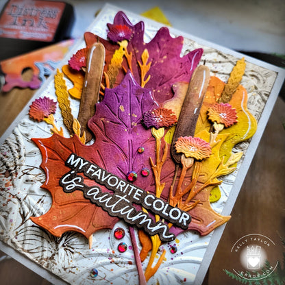 Autumn-themed card with colorful leaves and text on a textured background