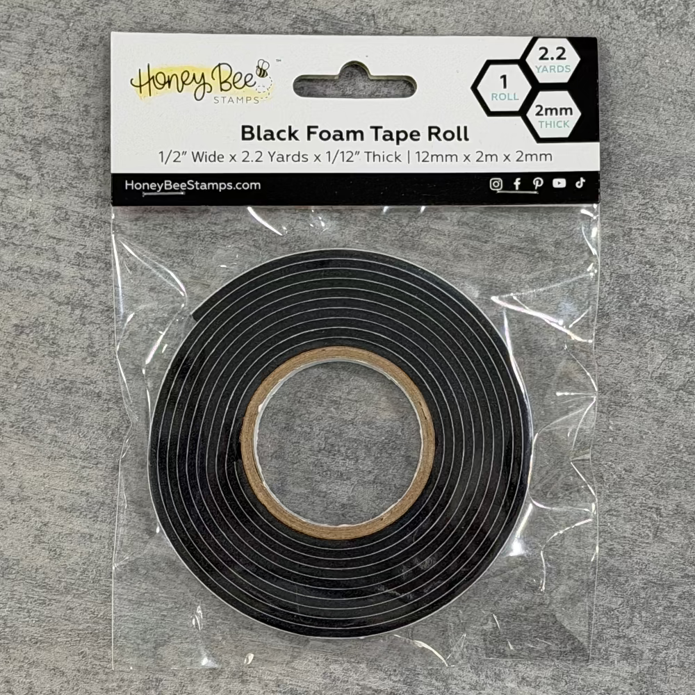 Black foam tape roll in clear packaging on a gray background