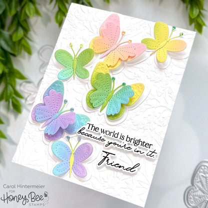 Card with colorful butterfly cutouts and a message on a white background