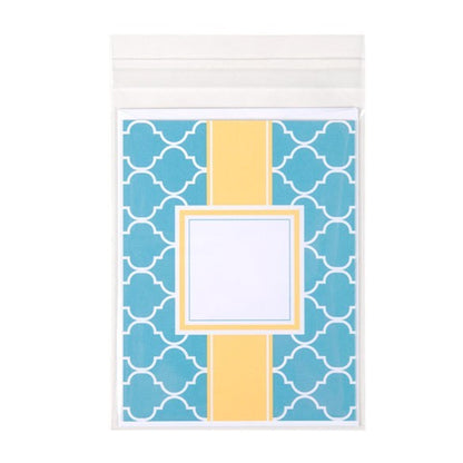 Notebook with blue geometric pattern and yellow square on a white background