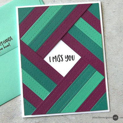 Card with 'I Miss You' message on a geometric patterned card and green envelope.