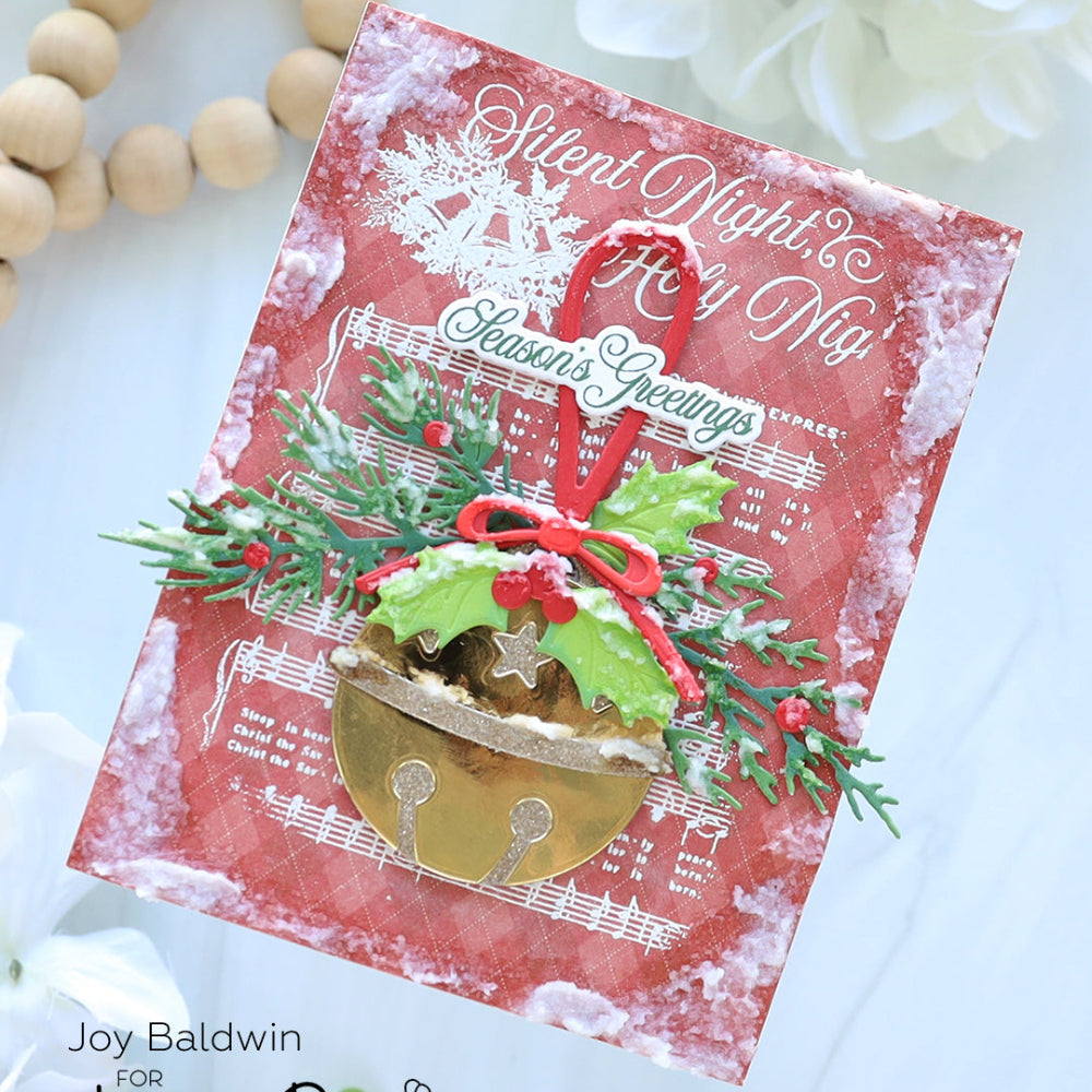 Christmas card with bell and holly design on a red background