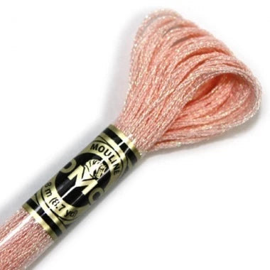 Spool of pink embroidery floss with Mollie Makes label on a white background