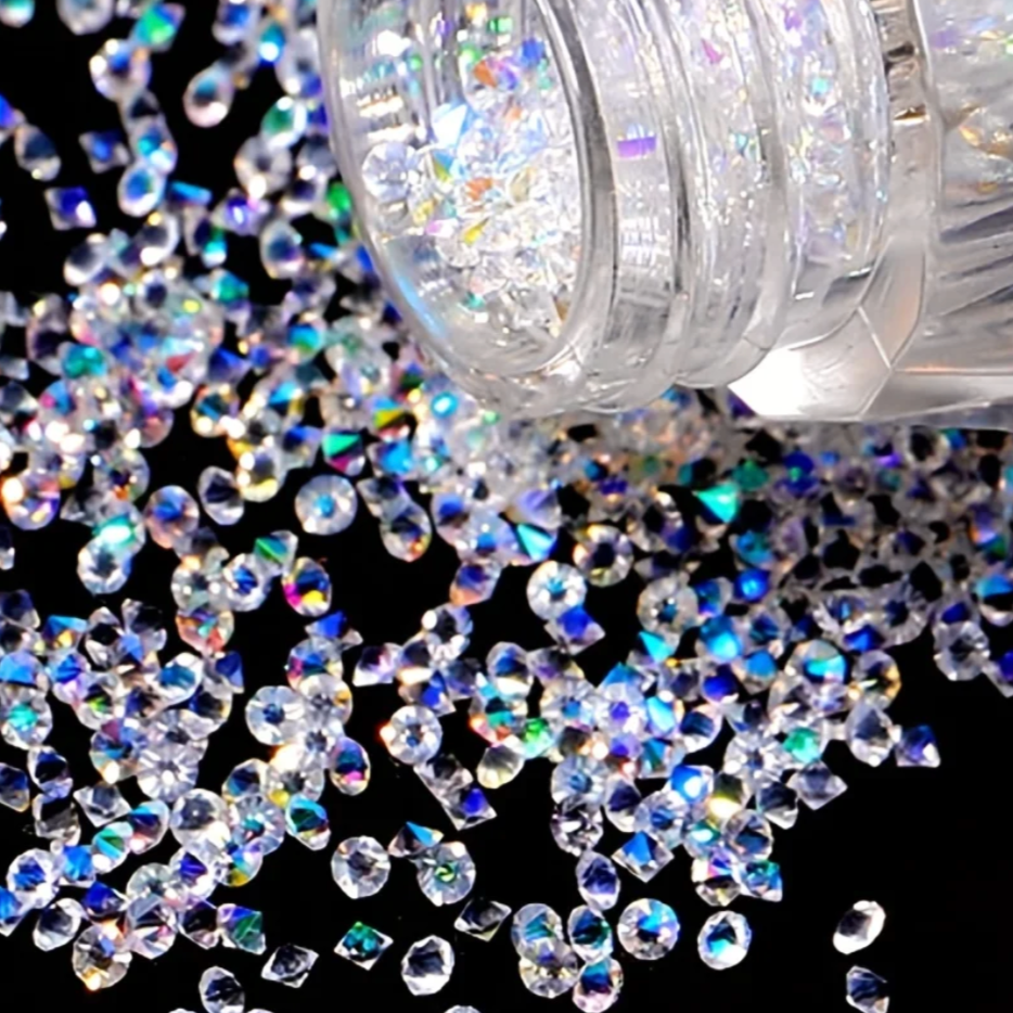 Clear nail art rhinestones with a bottle on a black background